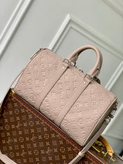 KEEPALL BANDOULIÈRE 34 BAG IN LIGHT BROWN MONOGRAM TAURILLON CALFSKIN