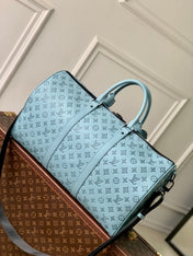 KEEPALL BANDOULIÈRE 50 IN SKY BLUE MONOGRAM SHADOW EMBOSSED CALFSKIN