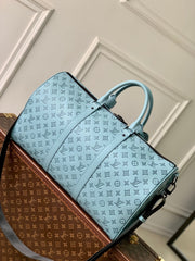 KEEPALL BANDOULIÈRE 50 IN SKY BLUE MONOGRAM SHADOW EMBOSSED CALFSKIN