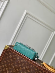 STEAMER WEARABLE WALLET 18 IN TEAL GREEN MONOGRAM TAURILLON CALFSKIN