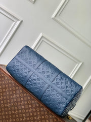 KEEPALL BANDOULIÈRE 50 IN DARK BLUE MONOGRAM SHADOW EMBOSSED CALFSKIN
