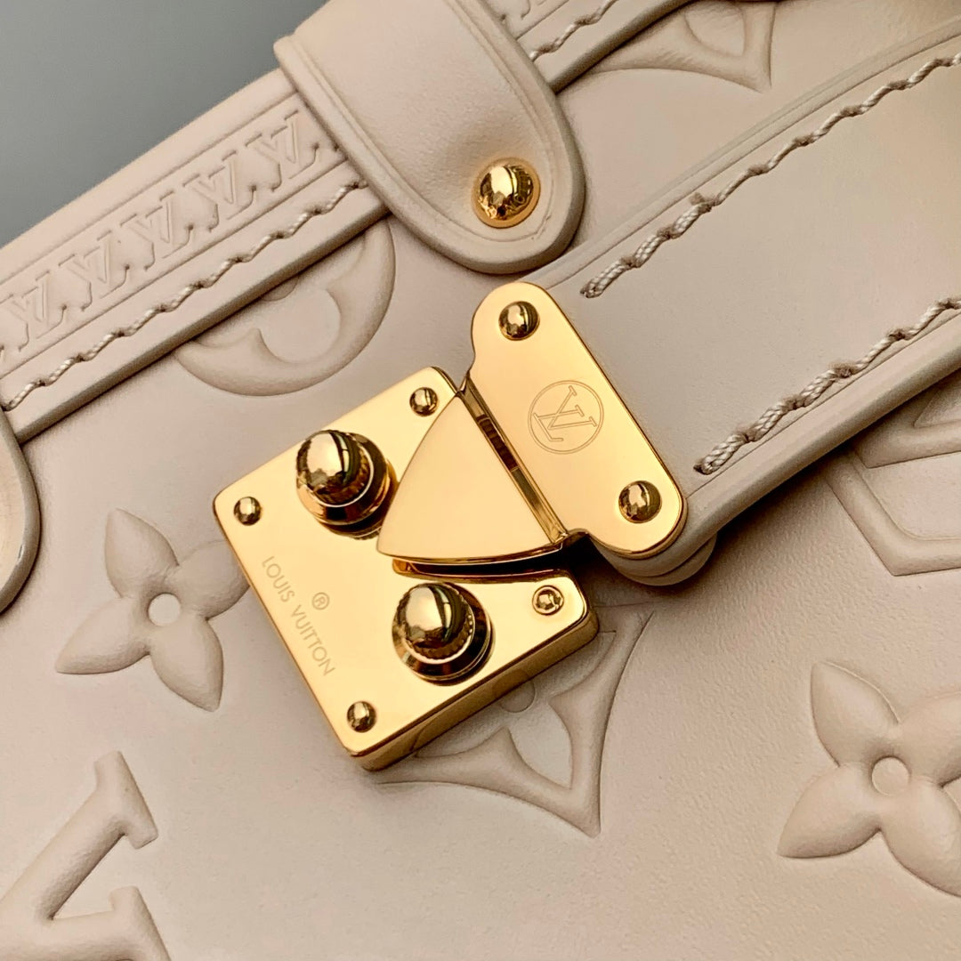 SIDE TRUNK 19 IN BEIGE MONOGRAM BOLD CALFSKIN GOLD HARDWARE