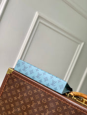 POCHETTE VOYAGE 26 IN SKY BLUE MONOGRAM ECLIPSE CALFSKIN