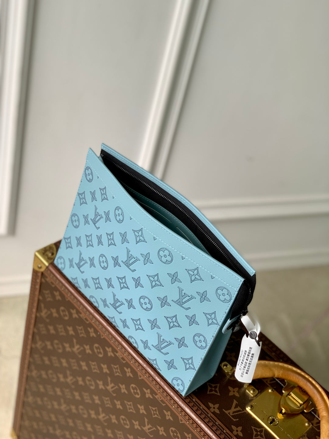 POCHETTE VOYAGE 26 IN SKY BLUE MONOGRAM ECLIPSE CALFSKIN
