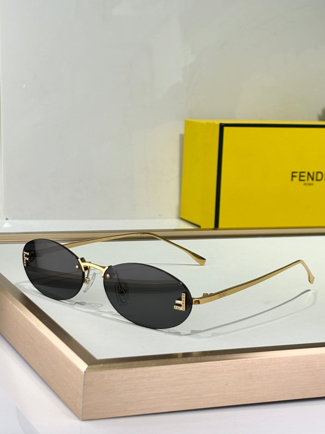 FIRST CRYSTAL RIMLESS OVAL FRAME SUNGLASSES FE4075US IN METAL