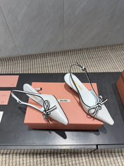 MIUMIU 26S SLINGBACK 55MM IN WHITE AND BLACK CALFSKIN WITH BOW