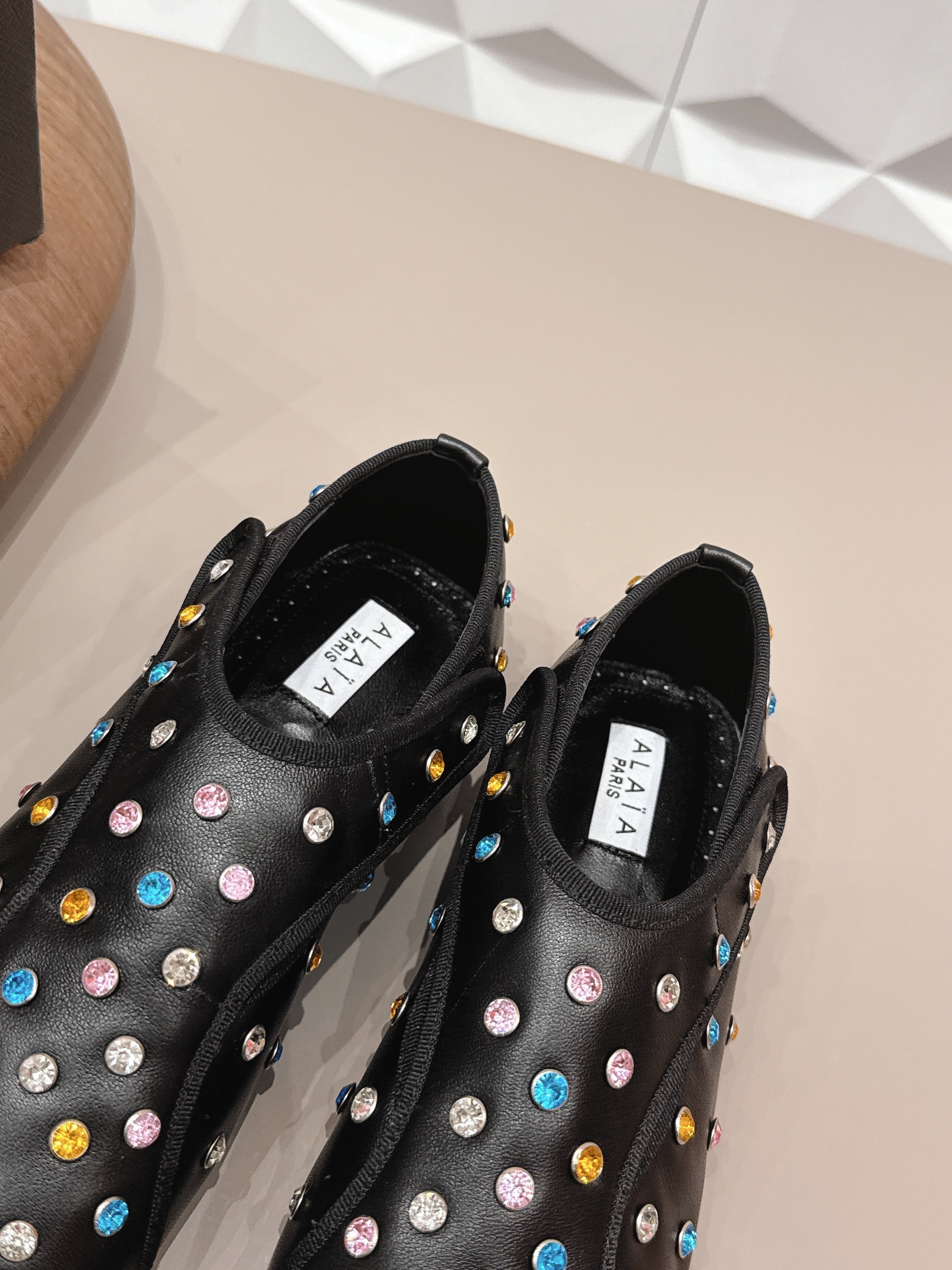 ALAIA 26S EMBELLISHED FLATS IN BLACK LAMBSKIN