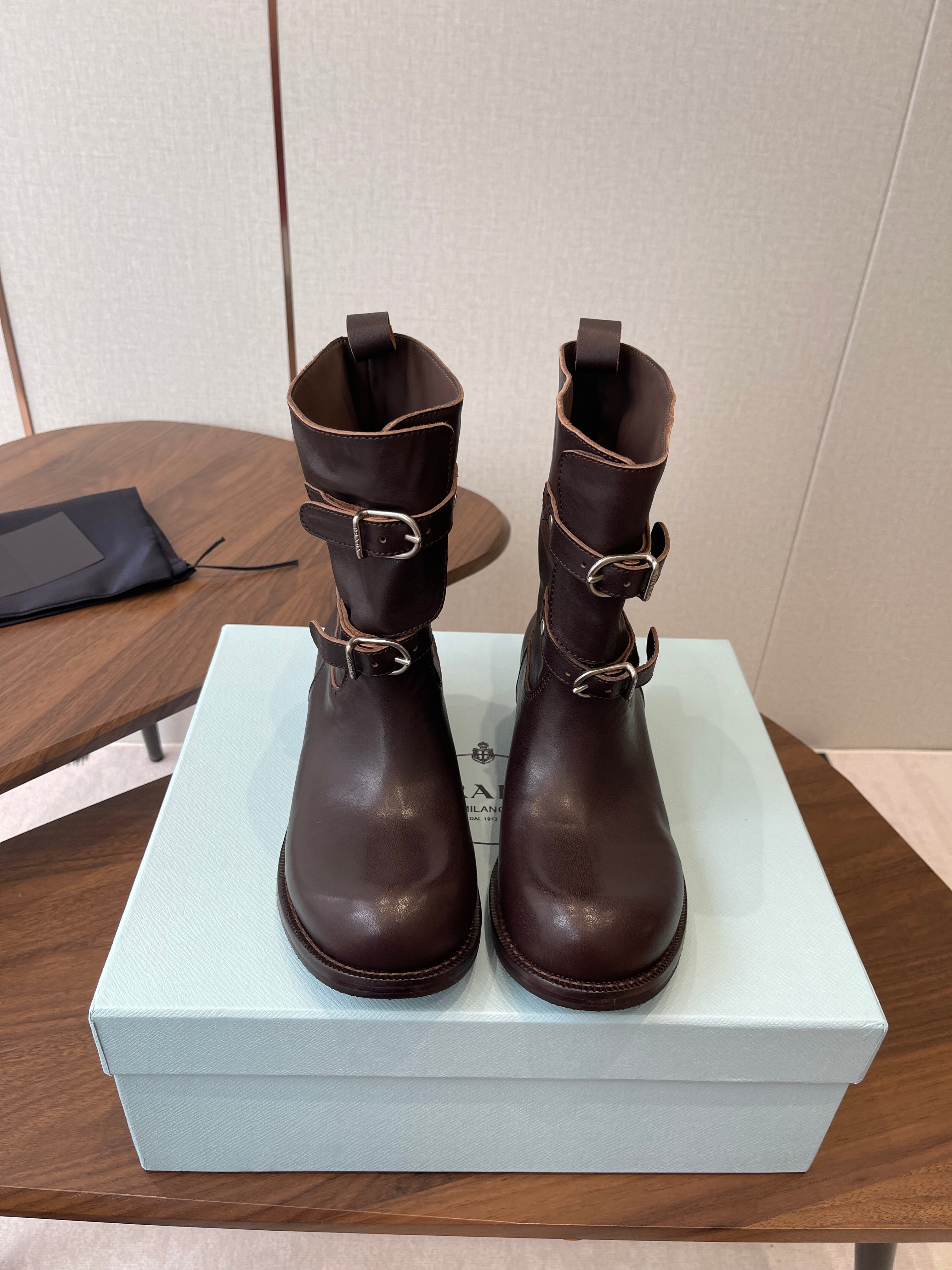 PRADA 25S TWO-BUTTON COWBOY BOOTS IN DARK BROWN CALFSKIN WITH SILVER HARDWARE