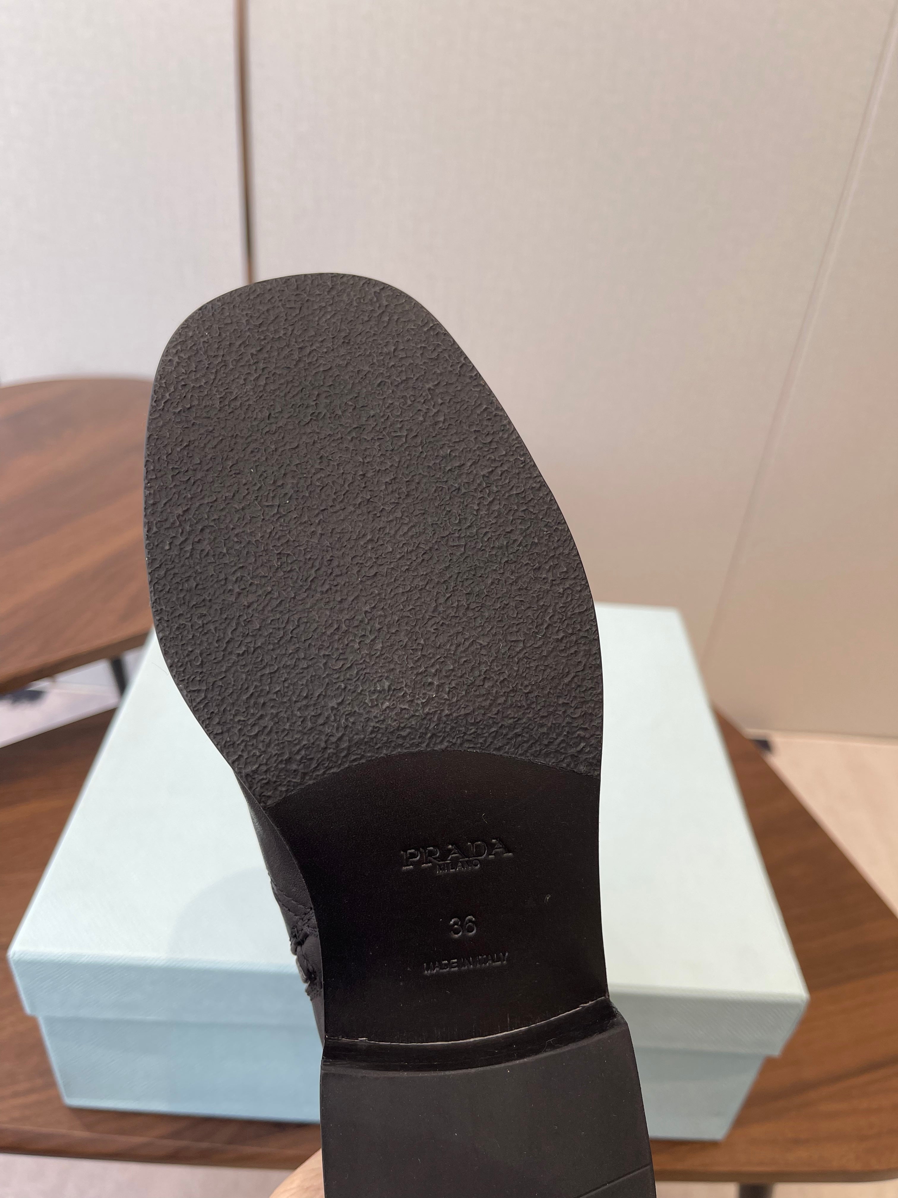 PRADA 25S COWBOY BOOTS IN DARK BLACK-BROWN CALFSKIN