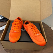 PRADA 25S SNEAKER IN ORANGE SILK