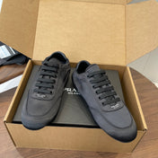 PRADA 25S SNEAKER IN BLACK SILK