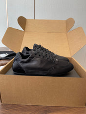 PRADA 25S SNEAKER IN BLACK SILK