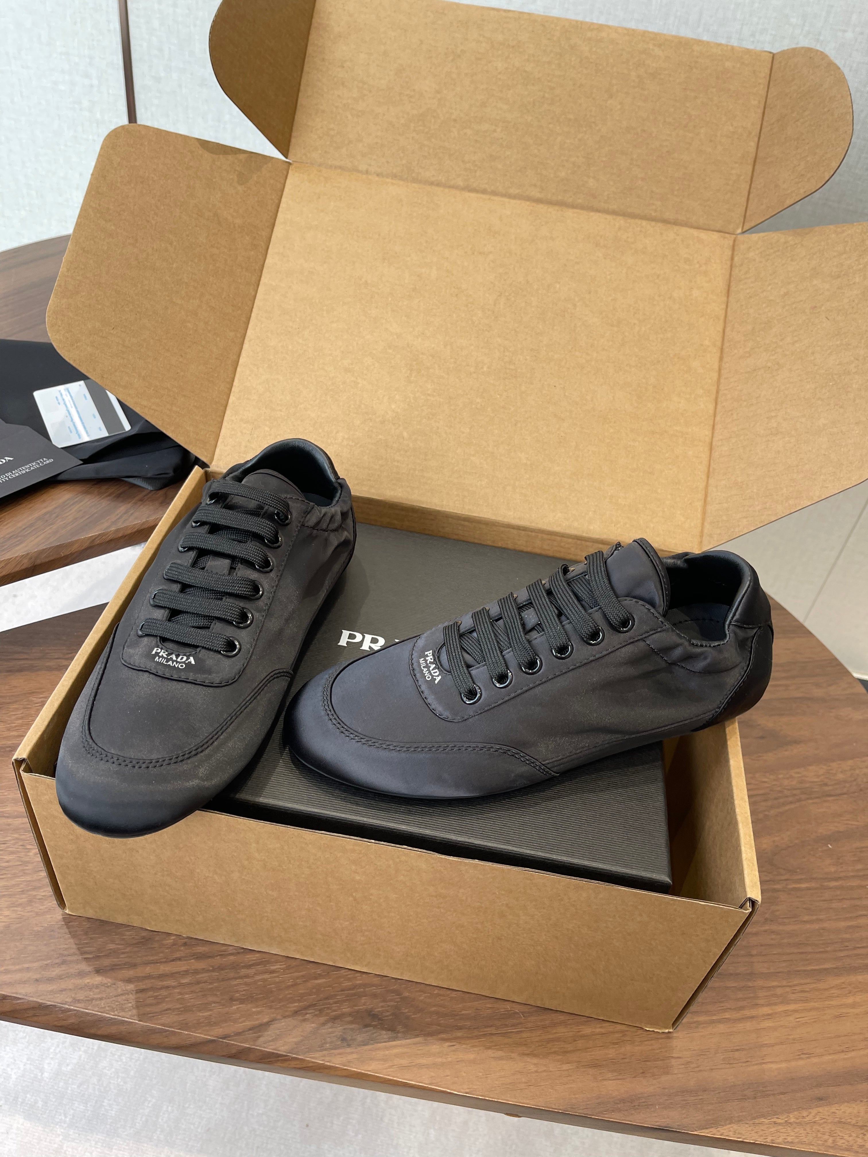 PRADA 25S SNEAKER IN BLACK SILK