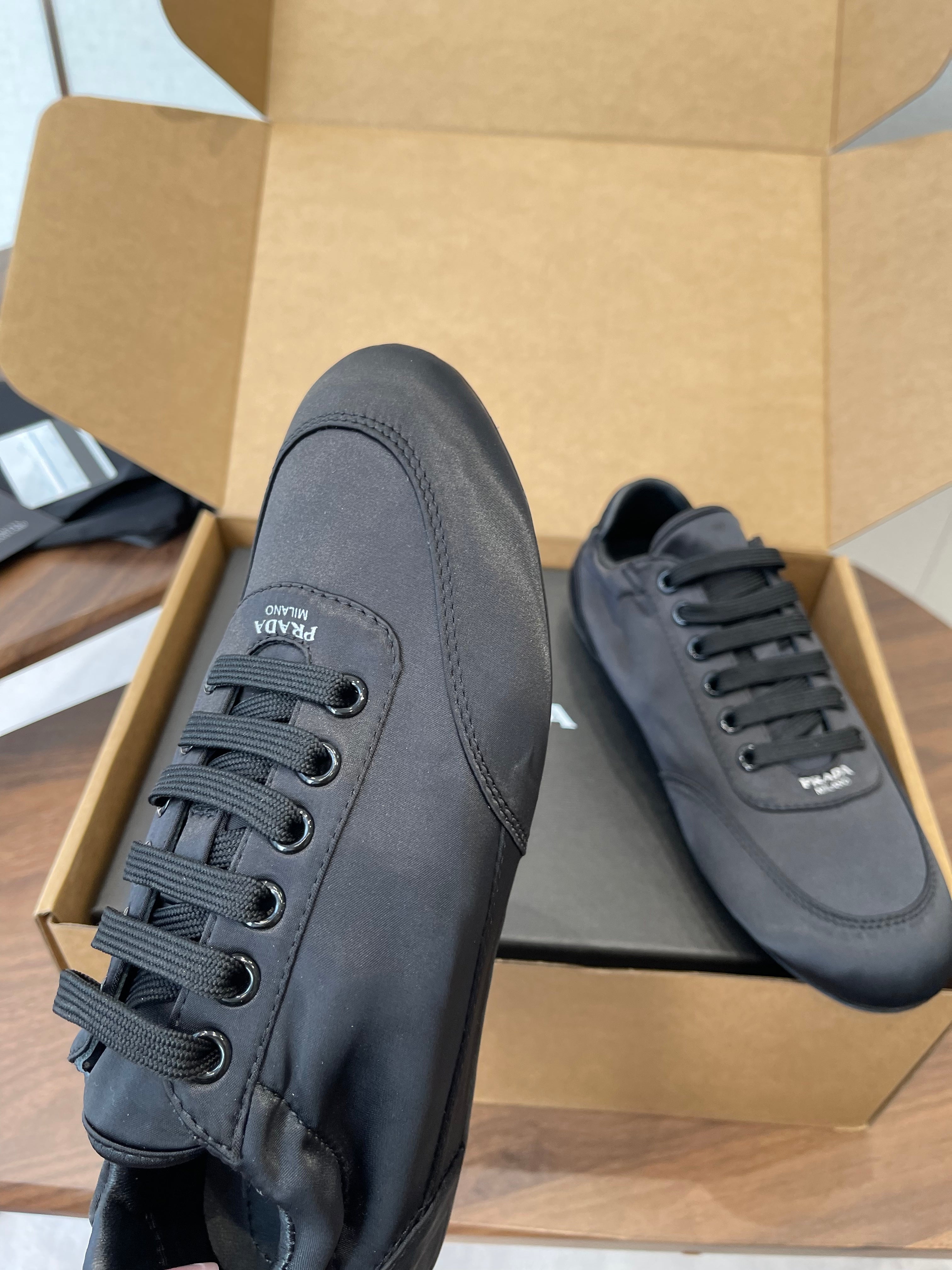 PRADA 25S SNEAKER IN BLACK SILK