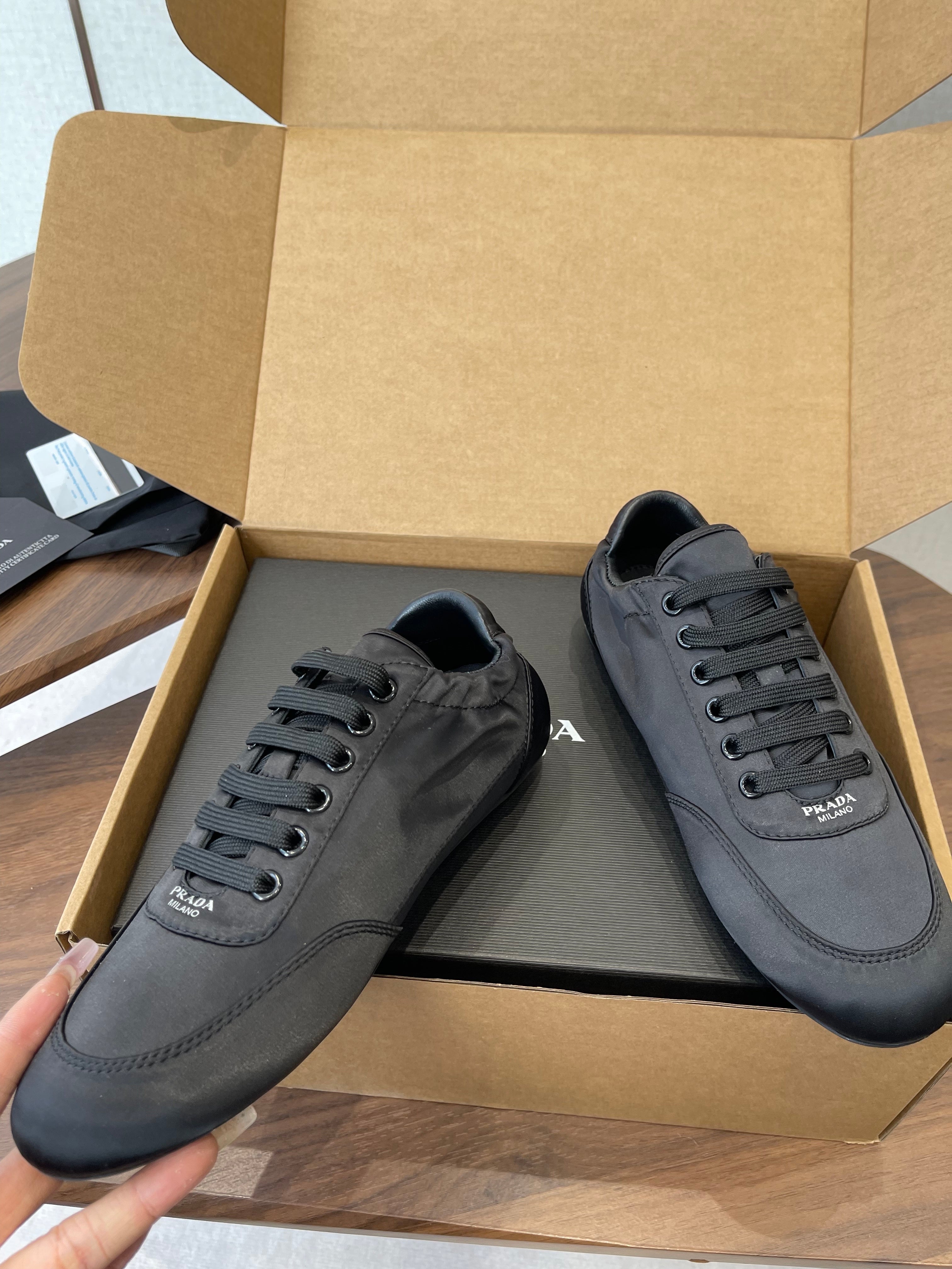 PRADA 25S SNEAKER IN BLACK SILK