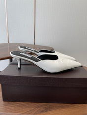 ALAIA 26S HEELED MULES 50 MM IN WHITE GLOSSY CALFSKIN