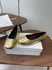 THE ROW 26S FLATS IN GOLD CALFSKIN