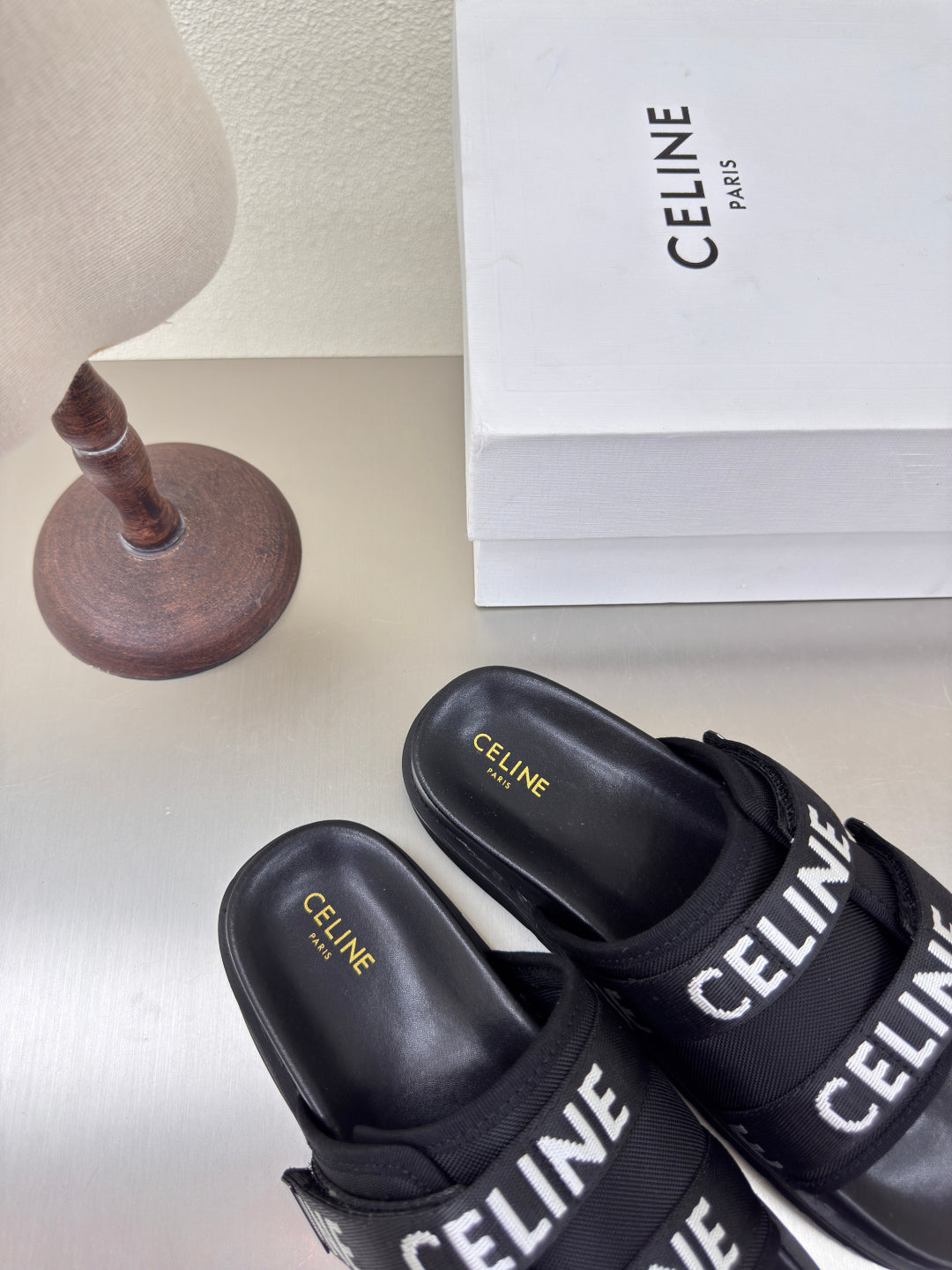 CELINE 25S FLAT SANDALS ARC DE TRIOMPHE IN BLACK CALFSKIN AND CANVAS