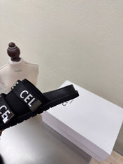 CELINE 25S FLAT SANDALS ARC DE TRIOMPHE IN BLACK CALFSKIN AND CANVAS