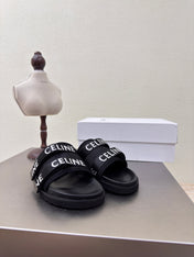 CELINE 25S FLAT SANDALS ARC DE TRIOMPHE IN BLACK CALFSKIN AND CANVAS