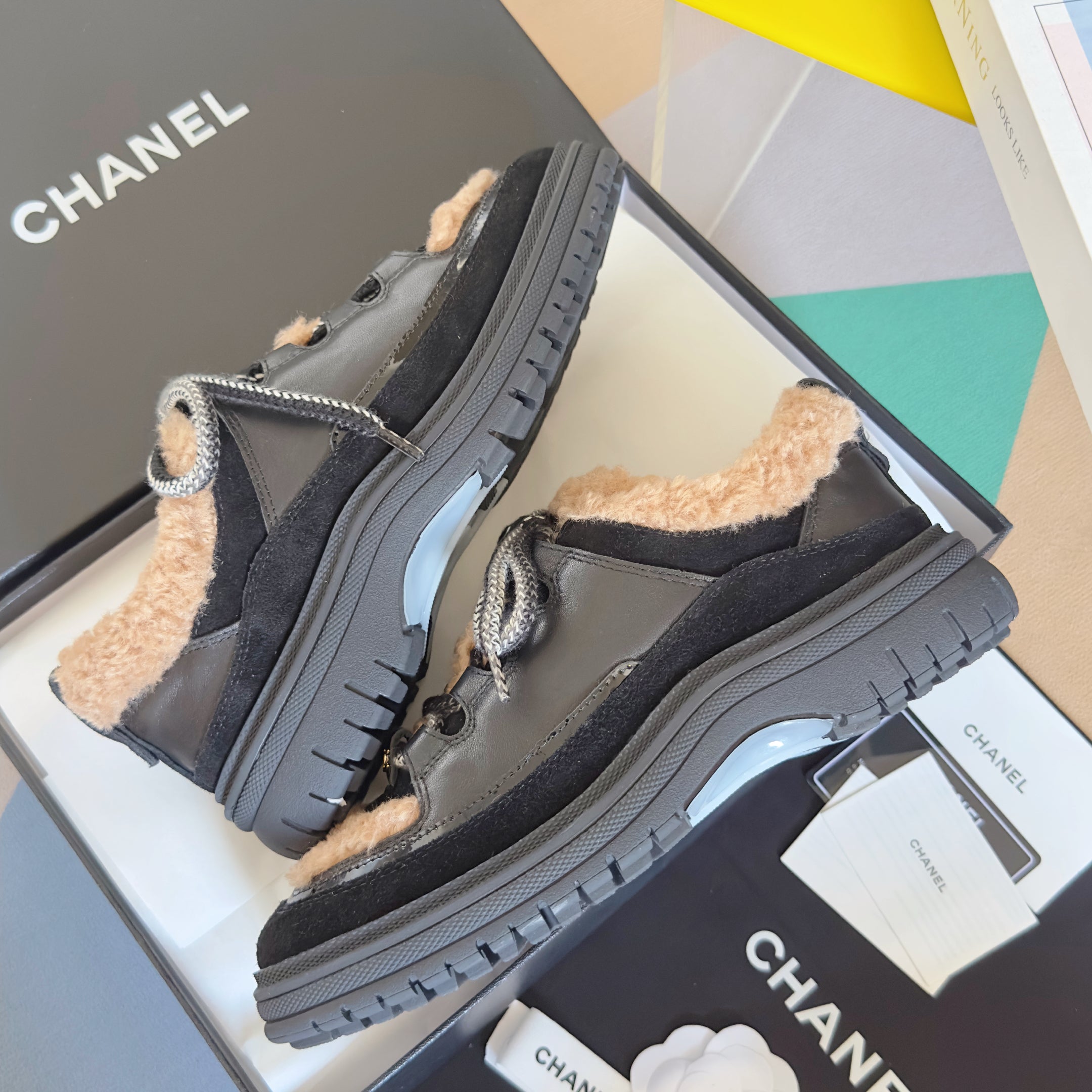 CHANEL 25S SNEAKERS WITH FUR ACCENTS 40MM IN BLACK AND BROWN CALFSKIN