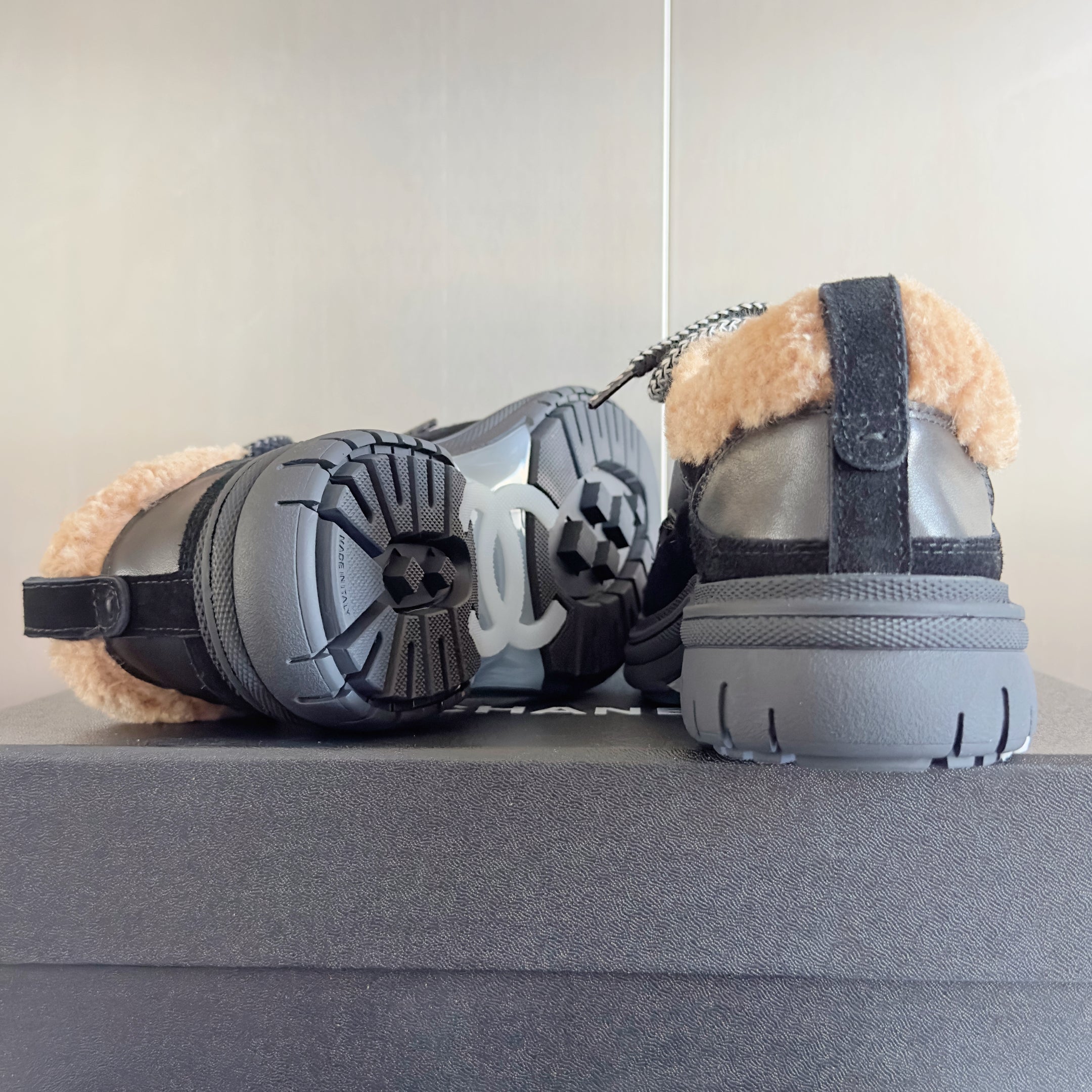 CHANEL 25S SNEAKERS WITH FUR ACCENTS 40MM IN BLACK AND BROWN CALFSKIN