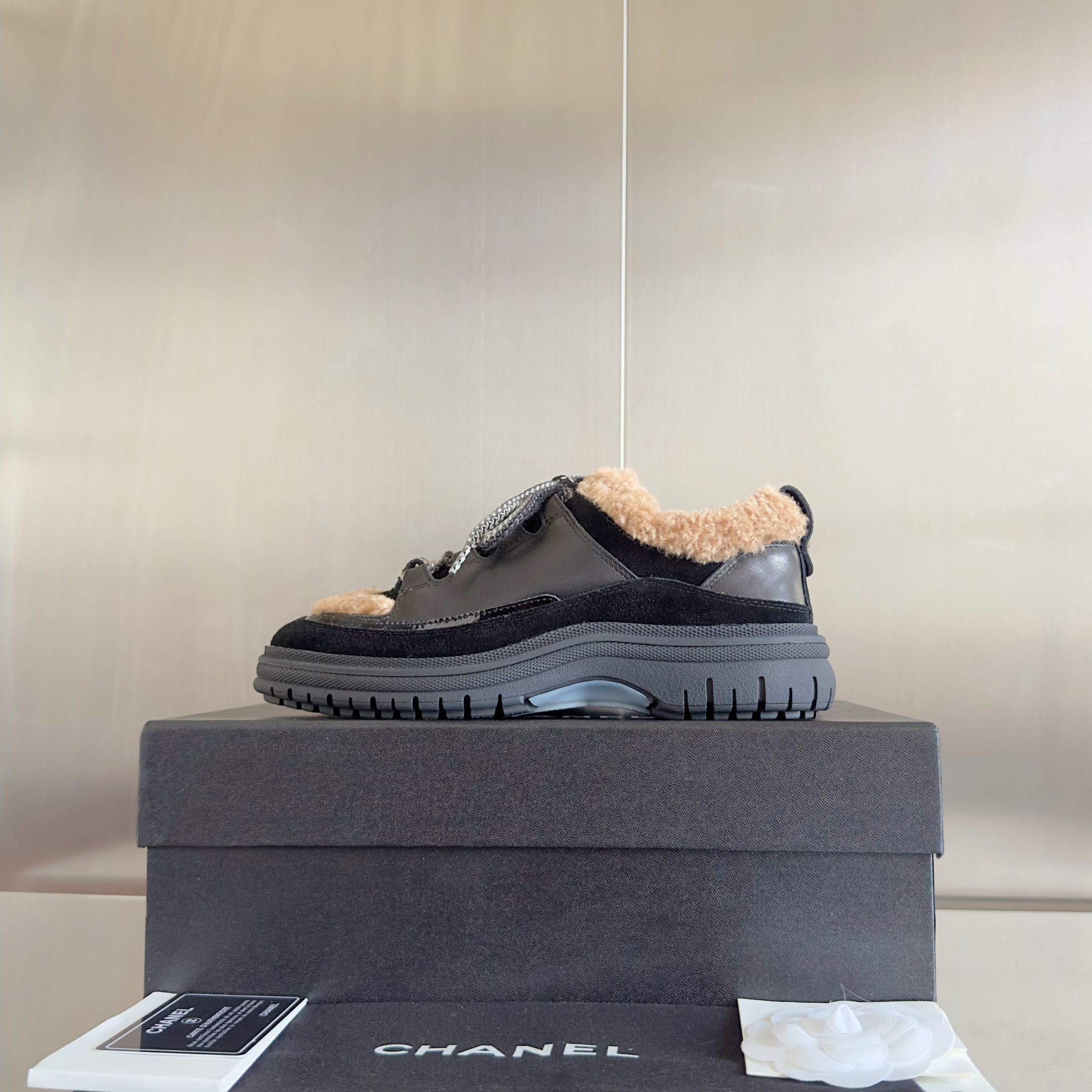 CHANEL 25S SNEAKERS WITH FUR ACCENTS 40MM IN BLACK AND BROWN CALFSKIN