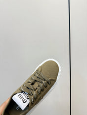 MIUMIU 26S PLATFORM SNEAKERS IN OLIVE GREEN CANVAS