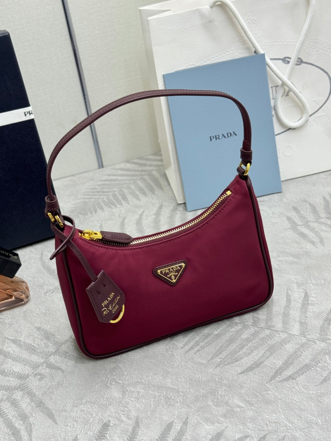 PRADA 25S RE-EDITION 2005 MINI BAG 22 IN BURGUNDY RE-NYLON AND SAFFIANO