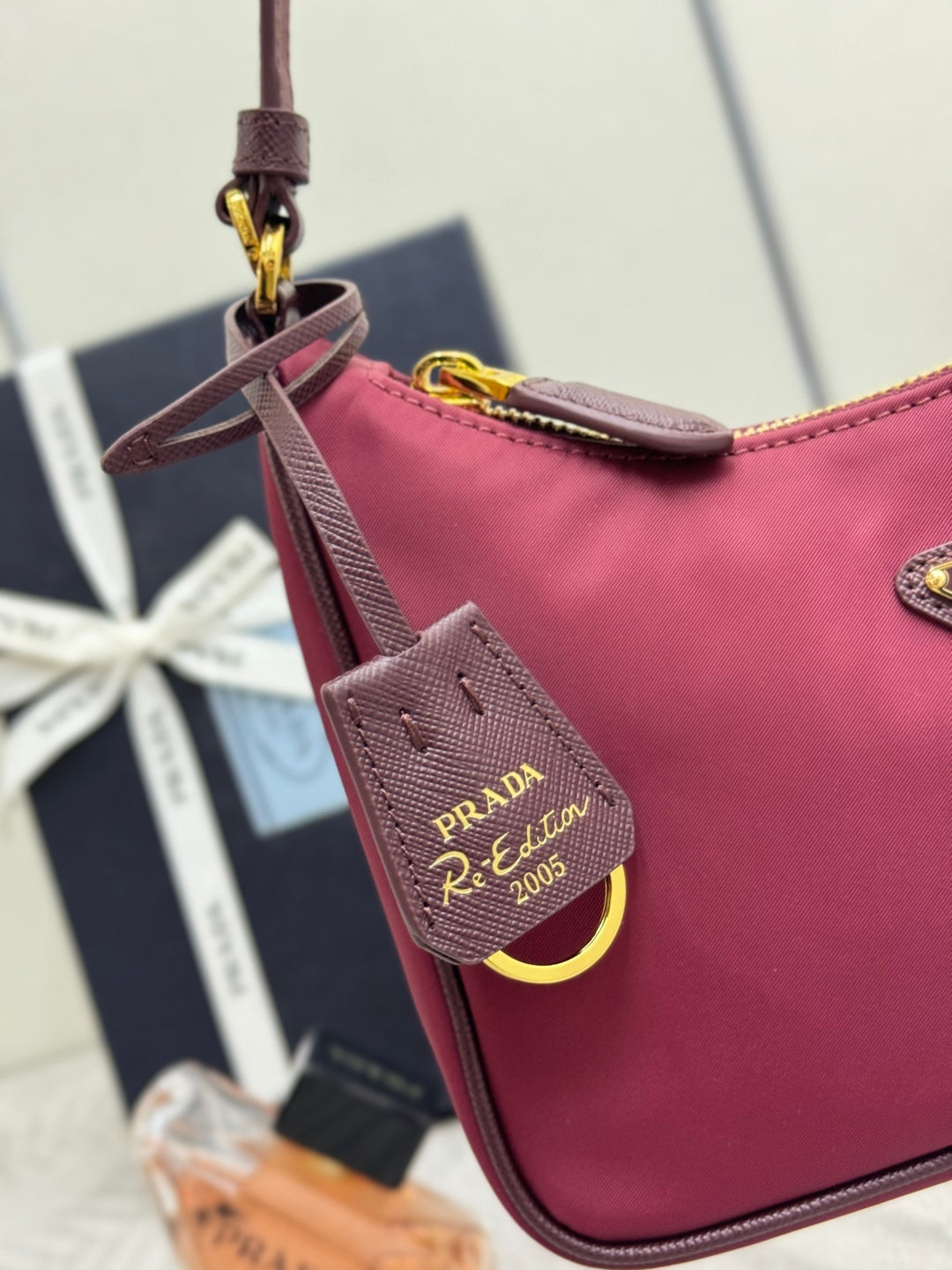 PRADA 25S RE-EDITION 2005 MINI BAG 22 IN BURGUNDY RE-NYLON AND SAFFIANO