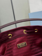 PRADA 25S DUET BUCKET BAG 23 IN BURGUNDY RE-NYLON GOLD HARDWRE