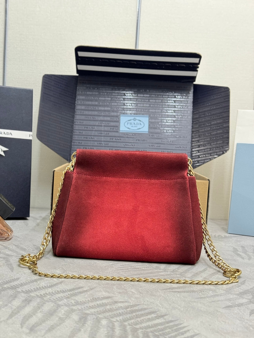 PRADA 25S ENCHAINE MINI BAG 22 IN RUBY RED SUEDE GOLD HARDWARE