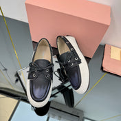 BOAT SHOES IN BLACK CALFSKIN AND WHITE CANVAS