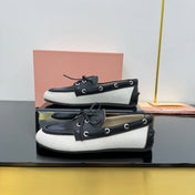 BOAT SHOES IN BLACK CALFSKIN AND WHITE CANVAS