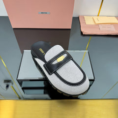 MULES SLIPPERS IN BLACK CALFSKIN AND WHITE DOTS CANVAS WITH GOLD COIN