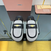 MULES SLIPPERS IN BLACK CALFSKIN AND WHITE DOTS CANVAS WITH GOLD COIN
