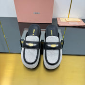 MULES SLIPPERS IN BLACK CALFSKIN AND WHITE DOTS CANVAS WITH GOLD COIN