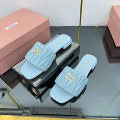 MATELASSÉ SLIDES IN BABY BLUE CALFSKIN