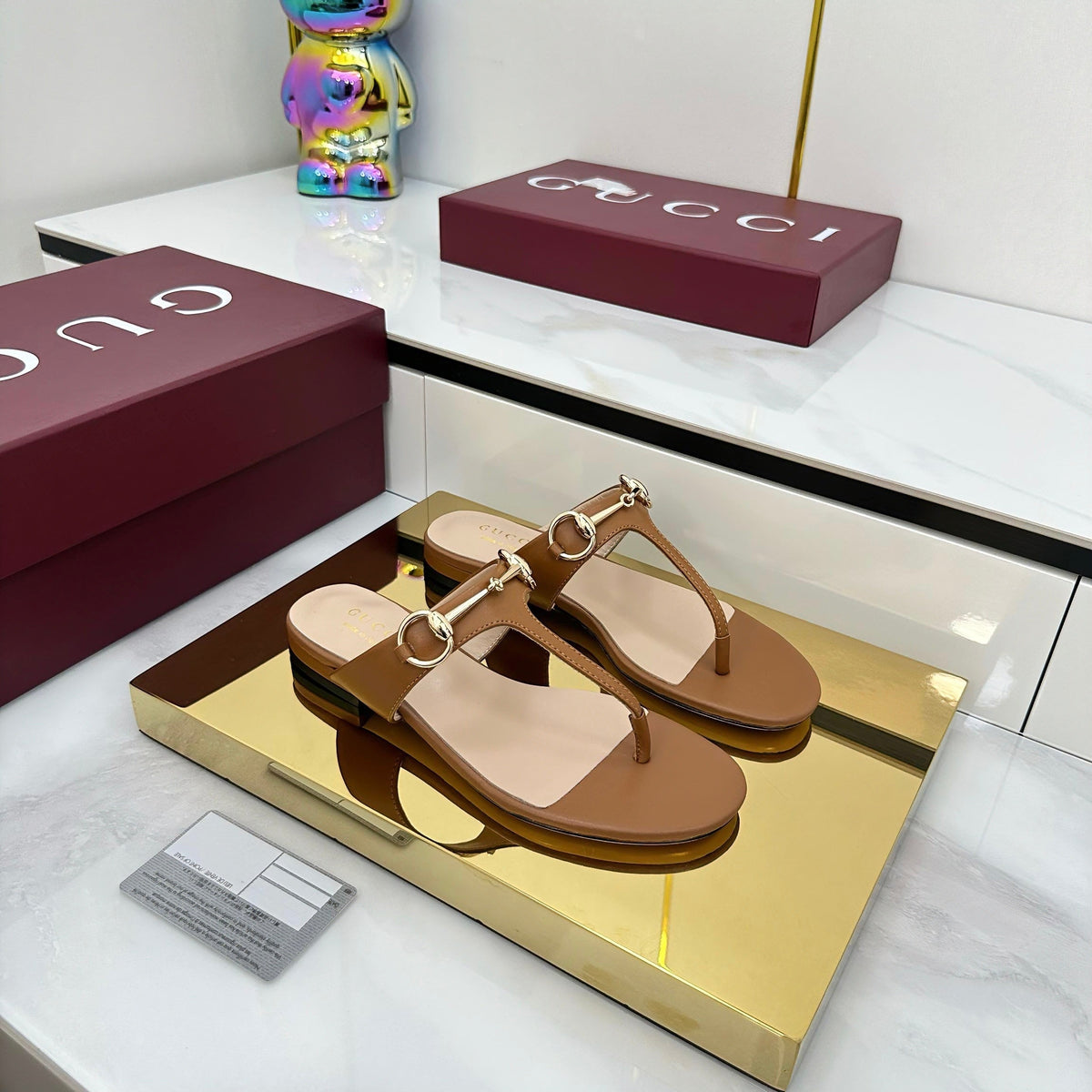 THONG SANDALS IN BROWN LAMBSKIN WITH GOLD HARDWARE