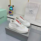 PRADA 25S CROSS LACED SNEAKERS IN WHITE CALFSKIN
