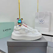 PRADA 25S CROSS LACED SNEAKERS IN WHITE CALFSKIN