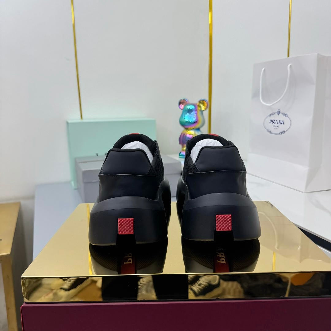 PRADA 25S CROSS LACED SNEAKERS IN BLACK CALFSKIN