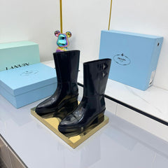 PRADA 25S BROOKLYN BOOTS 50MM IN BLACK GLOSSY CALFSKIN WITH LOGO