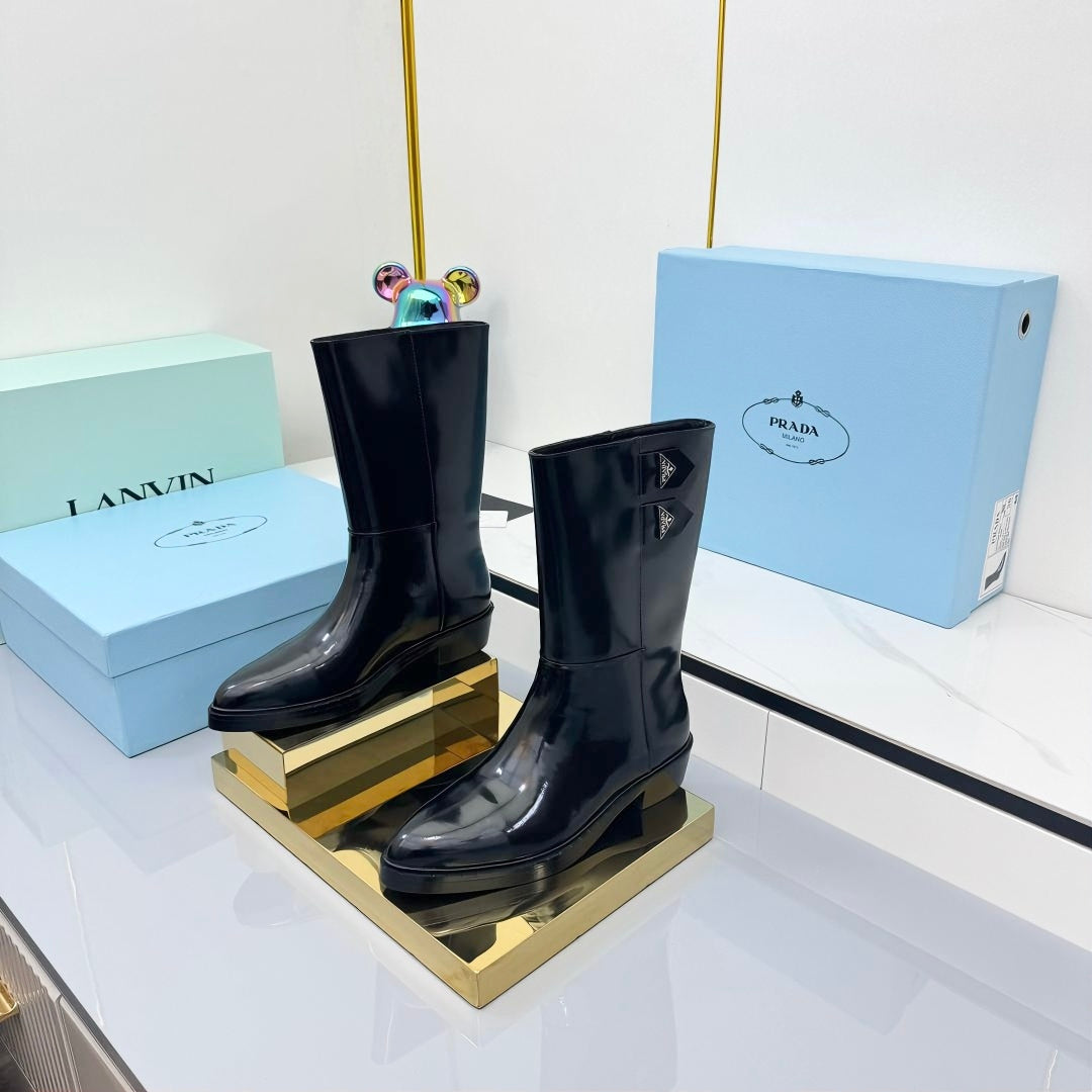PRADA 25S BROOKLYN BOOTS 50MM IN BLACK GLOSSY CALFSKIN WITH LOGO
