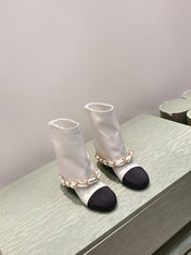 CHANEL 25S CALF-LENGTH BOOTS 45MM IN WHITE AND BLACK CALFSKIN GOLD HARDWARE