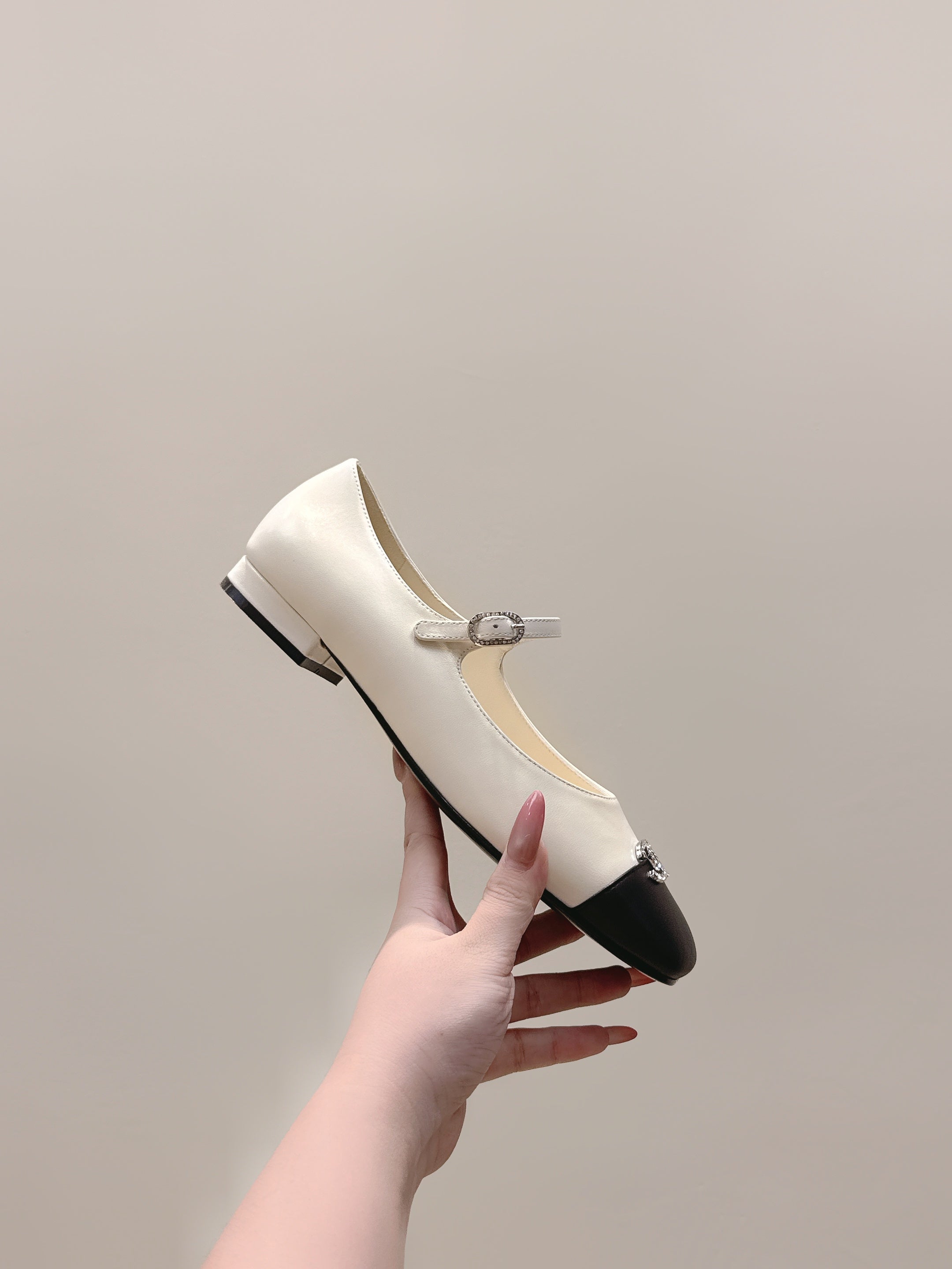 CHANEL 25S MARY JANE FLATS IN IVORY LAMBSKIN WITH BLACK CAP TOE SILVER HARDWARE