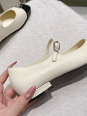 CHANEL 25S MARY JANE FLATS IN IVORY LAMBSKIN WITH BLACK CAP TOE SILVER HARDWARE