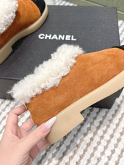 CHANEL 25S SHORT SUEDE BOOTS IN CARAMEL AND BLACK WITH SHEEPSKIN LINING