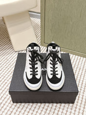 CHANEL 25S HIGH-TOP SNEAKERS IN BLACK AND WHITE CALFSKIN AND SUEDE