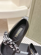 CHANEL 25S MARY JANES IN BLACK SHEARLING AND GROS GRAIN